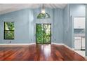 Bright living room featuring hardwood floors and a view to the backyard at 45 S Houle Ave, Sarasota, FL 34232