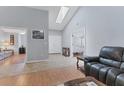 Spacious living room with hardwood floors and vaulted ceilings at 6935 Arbor Oaks Cir, Bradenton, FL 34209