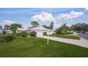 House exterior with driveway, landscaping, and two-car garage at 3653 Bonaventure Ct, Sarasota, FL 34243