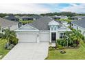 Aerial view of a home showcasing the house and surrounding landscape at 12734 Rainwashed Loop, Parrish, FL 34219