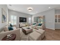 Bright living room with comfy seating and large TV at 111 172Nd E St, Bradenton, FL 34212