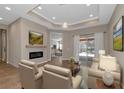 Spacious living room with fireplace and access to lanai at 111 172Nd E St, Bradenton, FL 34212