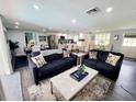 Open concept living space with a modern kitchen, dining area, and comfortable seating at 2244 Palm Ter, Sarasota, FL 34231