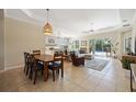 Open living space with a light and airy feel, seamlessly connecting to the kitchen and dining area at 11410 Griffith Park Ter, Bradenton, FL 34211