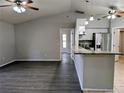Open floor plan featuring breakfast bar with granite counters and tile flooring at 5278 Sabrina Ter, North Port, FL 34286