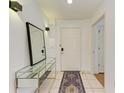 Bright and airy condo entryway with mirror at 3702 54Th W Dr # 104, Bradenton, FL 34210