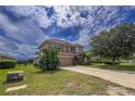 Two story house with stone accents at 12423 23Rd E St, Parrish, FL 34219