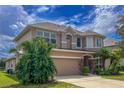 Two story house with palm trees at 12423 23Rd E St, Parrish, FL 34219
