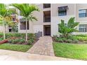 Modern apartment building with covered parking and landscaping at 18114 Gawthrop Dr # 403, Bradenton, FL 34211