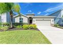 Front view of a single-story house with landscaping at 4519 Bent Tree Blvd, Sarasota, FL 34241