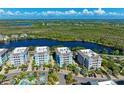 Luxury waterfront condos with a resort-style pool and lush landscaping at 391 Aruba Cir # 302, Bradenton, FL 34209