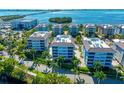 Luxury waterfront condos with a resort-style pool and lush landscaping at 391 Aruba Cir # 302, Bradenton, FL 34209