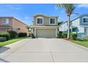 Two-story house with attached garage and landscaped yard at 7022 Chatum Light Run, Bradenton, FL 34212