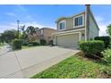Two-story house with attached garage and landscaped yard at 7022 Chatum Light Run, Bradenton, FL 34212