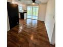Dining room with wood-look tile floor and access to patio at 20437 Midway Blvd, Port Charlotte, FL 33952