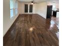 Living room featuring dark brown wood-look tile flooring at 20437 Midway Blvd, Port Charlotte, FL 33952