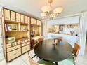 Dining area with unique built-in shelving at 1065 Gulf Of Mexico Dr # 302, Longboat Key, FL 34228