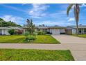 Single story home with a two-car garage and nicely landscaped yard at 3917 Cochise Ter, Sarasota, FL 34233