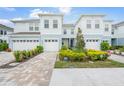 Exterior view of townhome community, showing building exteriors and landscaping at 4119 Via Sienna Cir, Sarasota, FL 34243