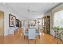 Open living space featuring wood floors, neutral paint, and many windows for ample light at 236 Hidden Bay Dr # 301, Osprey, FL 34229