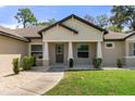 House with stone and shingle exterior and walkway at 11358 Lomita Wren Rd, Weeki Wachee, FL 34614
