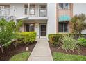 Inviting front entrance with well-maintained landscaping and clearly marked unit number at 4224 Madeira Ct # 3309, Sarasota, FL 34233