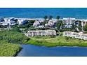 Aerial view of condo building near the water at 4600 Gulf Of Mexico Dr # 203, Longboat Key, FL 34228