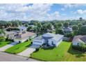 Aerial view of a light blue house with a large yard at 6933 43Rd E Ct, Sarasota, FL 34243