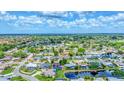 Expansive aerial view showcasing a residential community with lush greenery, serene ponds, and beautiful homes at 5306 19Th W Ave, Bradenton, FL 34209
