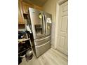 Stainless steel French door refrigerator in kitchen at 361 Porpoise Rd, Venice, FL 34293