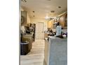 View of kitchen with light wood cabinets and flooring at 361 Porpoise Rd, Venice, FL 34293