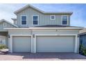 Two-story house with a two-car garage and landscaping at 11671 Little River Way, Parrish, FL 34219