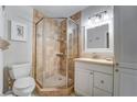 Bathroom with a shower, toilet and vanity at 8911 Midnight Pass Rd # 110, Sarasota, FL 34242