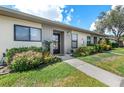 Inviting condo exterior with landscaped grounds and walkway at 6050 28Th W St # 14B, Bradenton, FL 34207