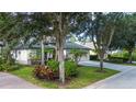 Two-story house with a two-car garage and landscaped yard at 13814 Nighthawk Ter, Lakewood Ranch, FL 34202