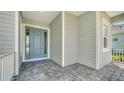 Front door entrance with paver walkway at 21281 Holmes Cir, Venice, FL 34293