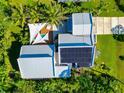 Home with solar panels, pool, and lush landscaping at 8175 Dittmar St, Port Charlotte, FL 33981