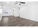 Bright living room with grey vinyl flooring and ceiling fan at 1522 Pleasant Rd # G23, Bradenton, FL 34207