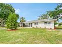 Front yard view of a charming house with a manicured lawn at 1610 Marilyn Ave, Bradenton, FL 34207