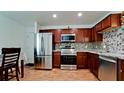 Modern kitchen with stainless steel appliances and granite countertops at 823 32Nd E Ave, Bradenton, FL 34208
