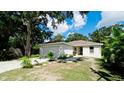 Cute one-story house with a grassy yard at 823 32Nd E Ave, Bradenton, FL 34208