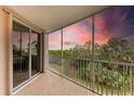 Screened balcony overlooking lush landscape and sunset at 2625 Terra Ceia Bay Blvd # 205, Palmetto, FL 34221