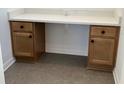 Built-in office nook with storage drawers, cabinets, and a white countertop, seamlessly blending functionality and style at 11718 Capstan Pl, Parrish, FL 34219