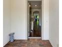 View through the doorway, showcasing the foyer with hardwood floors and a glimpse of the home's interior at 7572 Viola Loop, Lakewood Ranch, FL 34202