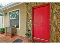 Inviting front entrance with a vibrant red door at 3447 Tallywood Ln # 7143, Sarasota, FL 34237