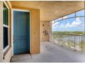 Private condo entry with balcony access and lake view at 10520 Boardwalk Loop # 605, Lakewood Ranch, FL 34202