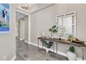 Stylish condo entry with modern console table at 10520 Boardwalk Loop # 605, Lakewood Ranch, FL 34202