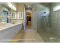 Spa-like Primary bathroom with double vanity and walk-in shower at 18138 Home Run Dr, Venice, FL 34293