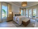 Spacious bedroom with access to the backyard and plenty of light at 18138 Home Run Dr, Venice, FL 34293