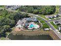 Community pool, playground, and parking area at 8810 Windlass Cv, Parrish, FL 34219